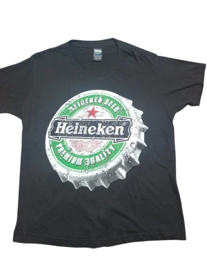 REMERA - HEINEKEN TAPITA - HOMBRE - NEGRO